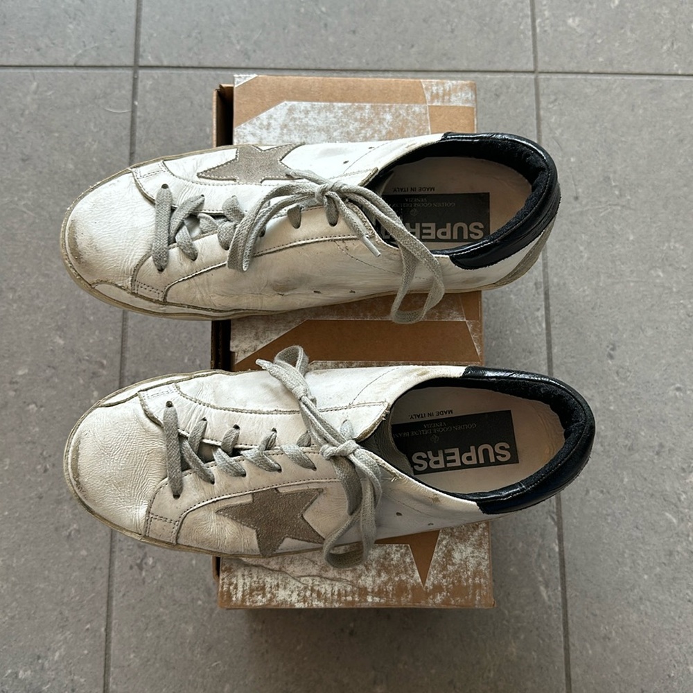 Golden Goose Super-Star with black heel tab and metal stud lettering sneakers